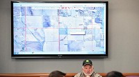 Soil and Water conservation technician Harvey Nix sits below a map highlighting land proposed for an industrial farm in Morgan Township during Tuesday's Porter County Development Review Committee meeting. (Kyle Telechan, Post-Tribune)
