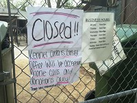 A "closed" sign is posted on the gate of the Madison County Humane Society on May 21, 2015, after two dogs died and more than a dozen became sick with what officials fear is a deadly flu virus. Staff photo by Traci Moyer
