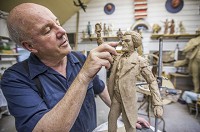 Artist Tuck Langland shows how he crafts molds for his bronze sculptures inside his home in Granger.SBT Photo/ROBERT FRANKLIN