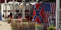 Take your pick: For $10, a Confederate flag or an American flag could be purchased from one vendor under the grandstand at the Wabash Valley Fairgrounds on Monday during the Vigo County Fair. Staff photo by Joseph C. Garza