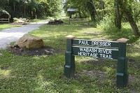 Good start: A sign at the south end of Fairbanks Park designates the start of the Paul Dresser section of the Wabash River Heritage Trail. The half-mile section is now open for hiking and biking.Hopes are to have it extended south to Interstate 70 in about 2 years. It will eventually link in with the rest of the Vigo County trail system. Staff photo by Jim Avelis