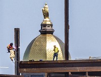 With the University of Notre Dame&rsquo;s Golden Dome visible in the background, construction continues on Duncan Student Center, the western building being constructed as part of the Campus Crossroads project. SBT Photo/ROBERT FRANKLIN