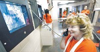 Tammy Ivey, an inmate at Hancock County Jal, talks with her boyfriend, Darrell Porter, through the new video chat system. Staff photo by Tom Russo