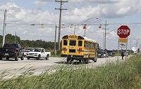 SAFETY FIRST: Boone County Sheriff&rsquo;s Office deputies will be escorting convoys of Western Boone Community School Corp. buses through the intersection of U.S. 52 and Indiana 47 twice a day until a state-mandated detour of Interstate 65 traffic is lifted. Staff photo by Brenda L. Holmes