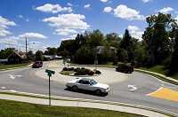 Traffic moves through the roundabout at the intersection of Schell and Daisy lanes in New Albany. Staff photo by Christopher Fryer