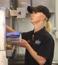 Shawna Morgan checks an order as she puts together a meal at Long John Silver's on Aug. 6, 2015. Kelly Lafferty Gerber | Kokomo Tribune
