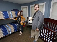 Foster parents Justin and Lydia Brownfield in the nursery Monday, August 10, 2015, of their Lafayette home. There is a shortage of foster parents in Tippecanoe County. Staff Photo by John Terhune