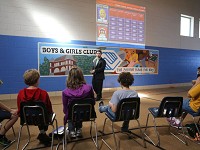 Steve O'Reilly, from Strategies for Youth in Cambridge, Mass., leads kids at the Valparaiso Boys &amp; Girls Club on Friday in a game of Juvenile Justice Jeopardy, which was designed to teach kids ages 12-18 about behavior and consequences, interacting with law enforcement, and making better choices in high-risk situations. The game is part of a pilot program that Strategies for Youth has been working on with the Porter County Juvenile Justice system, and hopes to implement the game in schools, churches, Boys &amp; Girls Clubs and the juvenile court. Staff photo by John Luke