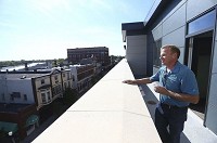 Scott Brandenburg takes in the view of Sycamore Street from the balcony of a two-bedroom apartment at Lofts at Union Street.Kelly Lafferty Gerber | Kokomo Tribune