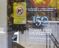 Safety measure: A sign reminding students and visitors that Indiana State University is a gun free campus can be seen in the background at this entrance to an ISU building on Saturday. Staff photo by Austen Leake