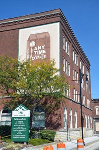 A decorative advertisement for Any Time Coffee serves as a reminder of the original use of what is now The Bierhaus Center at 328 N. Second St. The building was completed in 1901 as a wholesale grocery warehouse and later renovated for its current use as a medical-services center. Staff photo by Gayrle R. Robbins