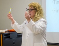 Valuable lesson: Nurse practitioner Donna Purviance shows Indiana State University police officers the naloxone they can use to help reduce drug overdose deaths. Staff photo by Austen Leake