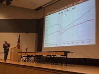 Micah Pollak, Indiana University Northwest assistant professor of economics, presents the economic forecast for Northwest Indiana during the 2015 Busiiness Overview and Outlook at Ivy Tech in Valparaiso. Staff photo by Rob Earnshaw
