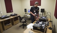 Isaac Fink digitizes vinyl albums at IU's media digitization and preservation initiative. Staff photo by David Snodgress