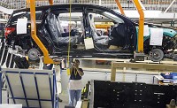 An employee works on the Mercedes-Benz R-Class production line in August at AM General&rsquo;s Commercial Assembly Plant in Mishawaka. The vehicles were previously made at a Mercedes-Benz plant in Tuscaloosa, Ala. SBT Photo/BECKY MALEWITZ