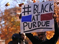 James Haynes, a Purdue University graduate student , holds a sign at a rally Nov. 13, 2015 as part of a protest against racial bias and exclusion. Haynes recently said he is skeptical that the university's new research initiatives to improve diversity and climate on campus will be effective. (Photo: File photo/Nate Chute/Journal &amp; Courier)