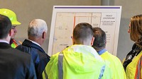 Gov. Mike Pence along with INDOT workers look at a map of the expansion plans for Interstate-65 in Lake County. (Jim Karczewski / Post-Tribune)