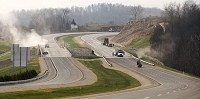 Workers put the finishing touches on Interstate 69 as it crosses Clear Creek southwest of Bloomington. The 27-mile stretch of I-69 between Bloomington and U.S. 231 near Crane is expected to open Wednesday afternoon.&nbsp;David Snodgress | Herald-Times