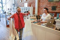 Barbara Bauer, left, gets advice from owner Denise Sudol while shopping at The Dragonfly Gallery in downtown Spencer. Jeremy Hogan | Herald-Times