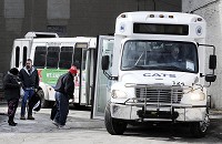 Riders load onto CATS buses at the downtown Anderson terminal. Staff photo by Don Knight
