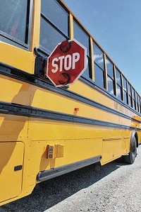 East Noble School Corp.&rsquo;s new stop-arm camera, shown below the stop sign near the bottom of the bus, is helping catch drivers who break the law by passing the bus when it&rsquo;s stopped. The district is hoping to equip more buses with the cameras in the future. Staff photo by Steve Garbacz