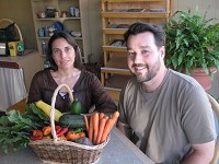 Sara and Dave Ring, at their Downtown Farm Stand organic grocery store. Staff photo by Keith Roysdon
