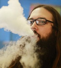 Justin Meier tries new flavors at a Bloomington vape shop in this photo from January. Staff photo by Jeremy Hogan