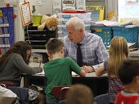 State Rep. Robert Behning, R-Indianapolis, spends the day Monday at Klondike Elementary School to learn firsthand the challenges teachers face. Here he helps April Lyons kindergarteners with a math problem. (Photo: Ron Wilkins/Journal &amp; Courier)