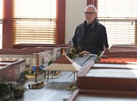 Keith Graber Miller looks over a model of downtown Goshen during a meeting of Downtown Goshen Inc. on April 12, 2016. Business owners discussed plans for what to do to Main Street following the completion of the U.S. 33 connector route. (Elkhart Truth photo/Sam Householder) 