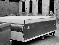 Jayco founder Lloyd Bontrager shows off the company's first fold up camping trailer. (Photo supplied/Jayco)