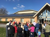 The congregation at Kern Road Mennonite Church in South Bend dedicates solar panels on its building last fall. Tribune File PhotoT