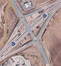 An artist's interpretaton of a project that will add turn lanes to ramps at I-65 and Whitestown Parkwy. In this view, northwest is at the lower left corner of the image. Submitted graphic.