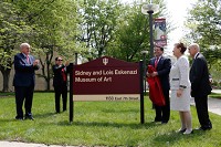 The Eskenazis (right) unveiling the new sign at the building dedication ceremony at the IU Art Museum on May 11, 2016, on the IU Bloomington campus. Photo by Eric Rudd