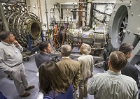 People tour the testing facilities during an open house Tuesday at the Notre Dame Turbomachinery Laboratory at Ignition Park in South Bend. Tribune Photo/ROBERT FRANKLIN