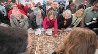 Visitors look at a map of a proposed rail line through Porter County on Tuesday, April 12, 2016, during a public meeting with the Surface Transportation Board in Valparaiso, IN. (Kyle Telechan, Post-Tribune)