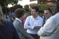 Eli Williams, from left, South Bend Mayor Pete Buttigieg, Chasten Glezman, the mayor's partner, and Common Council member Oliver Davies participate in a recent vigil for the victims of the Orlando attack. Staff photo by Santiago Flores