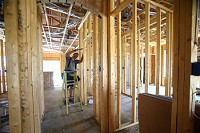 Jason Letson from Letson Electric wires a house under construction on Pond View Drive for VanNatter Construction on June 16, 2016. Staff photo by Tim Bath