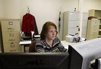 Deputy Clerk Cindy Comstock, Charlestown, works at her desk in the Clark County Clerk's Office in downtown Jeffersonville in this file photo. The office is one of two in the state using a new electronic filing system for court related paperwork. Staff file photo by Christopher Fryer