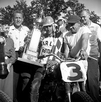 Paul Goldsmith in the victory circle after winning his last motorcycle race at Illiana Motor Speedway in Schererville in 1955. Illiana founder/owners Harry Molenaar is on the left. Photo provided by Stan Kalwasinski Collection