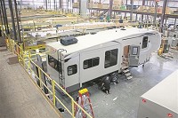 Workers assemble RVs at Grand Design in Middlebury on March 24, 2014. Grand Design RV has expanded production of its Reflections model due to demand, adding another production line in another building. (The Elkhart Truth)