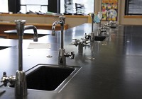 Faucets wait to be replaced Tuesday at Goshen High School science lab. Since the teacher's faucet in the lab tested positive, they are replacing all the sae models. Staff photo by Haley Ward