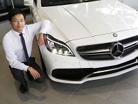 Professional Sales Associate Yuchen Zhang with a Mercedes Benz 2015 CLS63 AMG S-Model 4 Matic Coupe Tuesday, July 5, 2016, at Mike Raisor Automotive Group, 2911 East Main Street in Lafayette. The car retails for $118,665. Staff photo by John Terhune