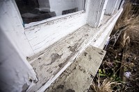 Paint chips off the exterior of a home on South Bend's near northwest side. Lead paint in older homes has caused children to test with high lead levels in their blood. Staff file photo by Becky Malewitz