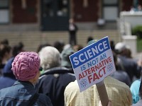 A crowd stands at Riehle Plaza as part of the March for Science on April 22, 2017, in Lafayette. Staff photo by Jeremy Ervin