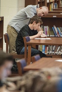 Carson Weddle, a sophomore at Bloomington High School South, gets help from school counselor Joel McKay during a study periods in the library earlier in April 2017. Staff photo by Chris Howell