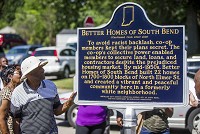 Leroy Cobb looks on during a ceremony for a state historical marker commemorating the Better Homes of South Bend development Saturday. His was one of the original families moving into the neighborhood in the 1950s. Staff photo by Robert Frnklin