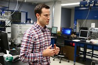 Dr. Nicholas Manicke, an Indiana University-Purdue University Indianapolis chemistry and chemical biology assistant professor, has developed a cartridge that may soon be able to detect concentrations on synthetic illicit drugs. Staff photo by Kelly Laffery Gerber