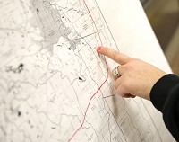 A local resident looks at a rail line map last year at a public meeting regarding the proposed Great Lake Basin Transportation freight railroad. Staff file photo by Jonathan Miano &nbsp; &nbsp; &nbsp; &nbsp; &nbsp; &nbsp; &nbsp; &nbsp; &nbsp; &nbsp; &nbsp; &nbsp; &nbsp;&nbsp;