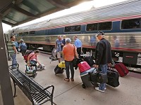 Passengers prepare to board the Cardinal at the Amtrak platform Thursday, June 29, 2017, at Riehle Plaza. On this morning, the Cardinal, which is scheduled to arrive at 7:36 a.m., arrived at 8:12 a.m. Staff photo by John Terhune/Journal &amp; Courier