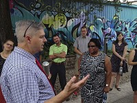 About 20 Bloomington city government officials toured West Kirkwood Avenue Thursday with Charles Marohn, left, president and founder of Strong Towns. Staff photo by Kurt Christian